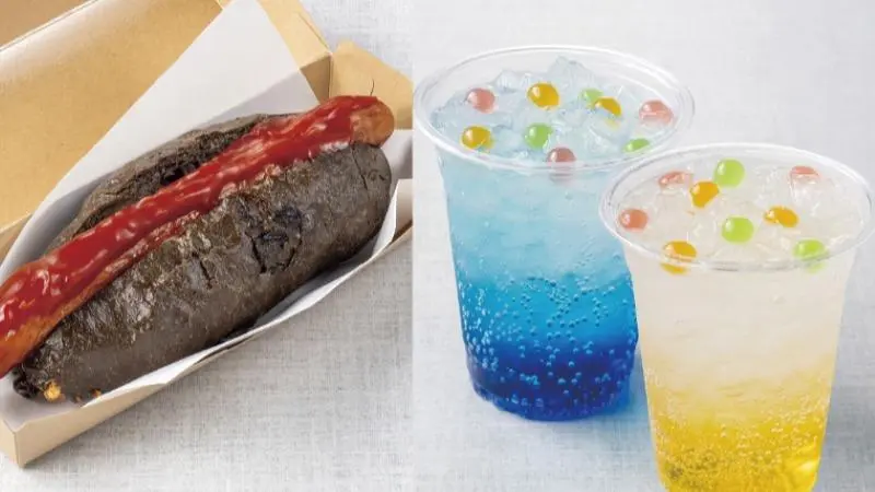 名古屋市科学館カフェのオリジナルメニュー。黒いバンズのホットドッグと、カラフルな炭酸ドリンク